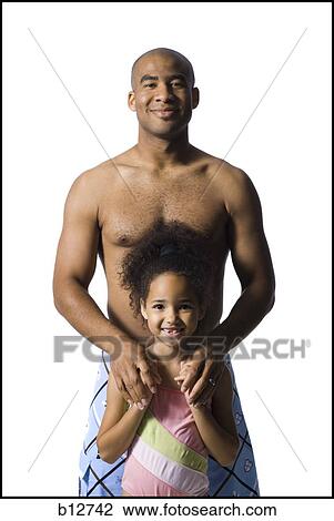 Stock Image - Father holding young daughter. Fotosearch