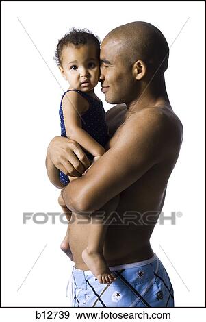 Father holding young daughter View Large Photo Image Stock Photo - Father holding young daughter. Fotosearch