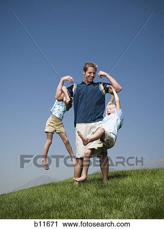 Father playing with son and daughter View Large Photo Image Stock Image - Father playing with son and daughter. Fotosearch