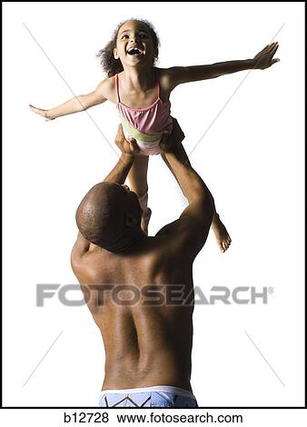 Stock Photo - Father playing with young daughter. Fotosearch