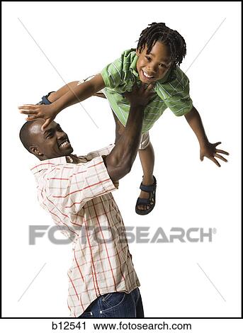 Stock Image - Father playing with young son. Fotosearch