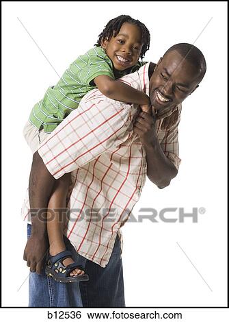 Stock Photograph - Father playing with young son. Fotosearch