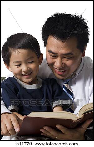Father reading story to son View Large Photo Image Stock Photo - Father reading story to son. Fotosearch