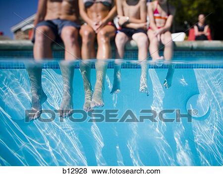 Feet dangling in swimming pool View Large Photo Image Stock Photo - Feet dangling in swimming pool. Fotosearch