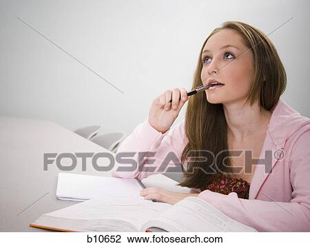 Stock Image - Female college student thinking. Fotosearch