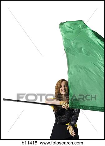 Stock Photography - Female color guard twirling flag. Fotosearch