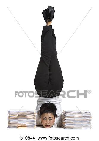 Picture - Female contortionist businesswoman. Fotosearch