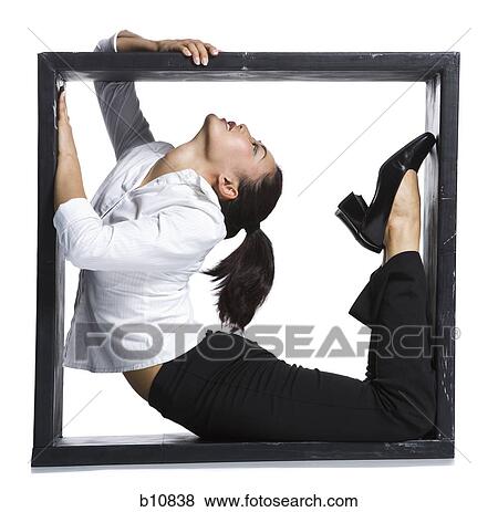 Female contortionist businesswoman inside the box View Large Photo Image Stock Photo - Female contortionist businesswoman inside the box. Fotosearch