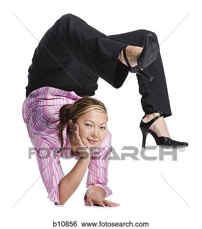Female contortionist businesswoman View Large Photo Image Stock Photograph - Female contortionist businesswoman. Fotosearch