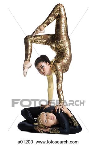 Female contortionist duo performing View Large Photo Image Stock Image - Female contortionist duo performing. Fotosearch
