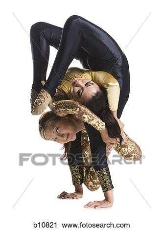 Female contortionist duo performing View Large Photo Image Stock Image - Female contortionist duo performing. Fotosearch
