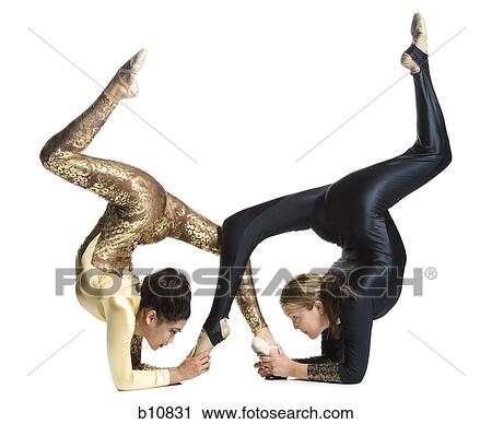 Female contortionist duo performing View Large Photo Image Stock Image - Female contortionist duo performing. Fotosearch