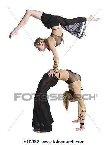 Female contortionist duo performing View Large Photo Image Stock Image - Female contortionist duo performing. Fotosearch