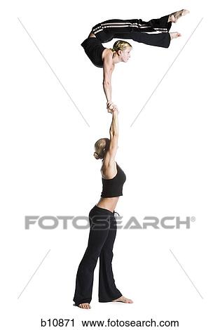 Female contortionist duo performing View Large Photo Image Stock Image - Female contortionist duo performing. Fotosearch