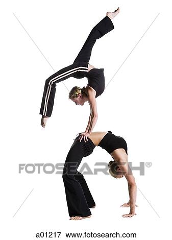 Female contortionist duo performing View Large Photo Image Stock Photo - Female contortionist duo performing. Fotosearch