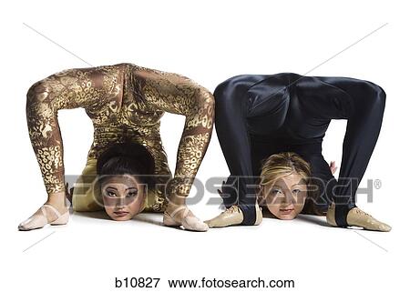Female contortionist duo performing View Large Photo Image Stock Photo - Female contortionist duo performing. Fotosearch