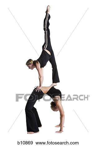 Female contortionist duo performing View Large Photo Image Stock Photo - Female contortionist duo performing. Fotosearch