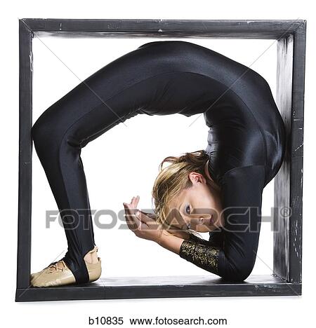 Female contortionist inside the box View Large Photo Image Stock Photography - Female contortionist inside the box. Fotosearch