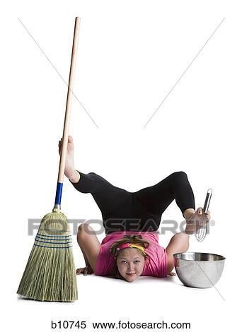 Female contortionist sweeping and mixing View Large Photo Image Stock Photography - Female contortionist sweeping and mixing. Fotosearch