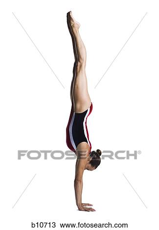 Stock Image - Female gymnast doing floor exercises. Fotosearch