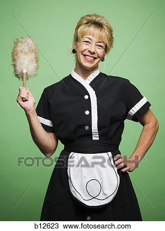 Female housekeeper with feather duster View Large Photo Image Stock Image - Female housekeeper with feather duster. Fotosearch