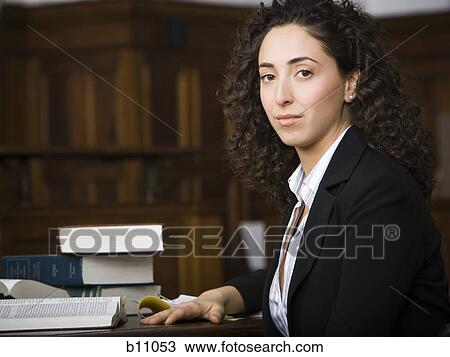 Female lawyer smiling in courtroom View Large Photo Image Stock Image - Female lawyer smiling in courtroom. Fotosearch