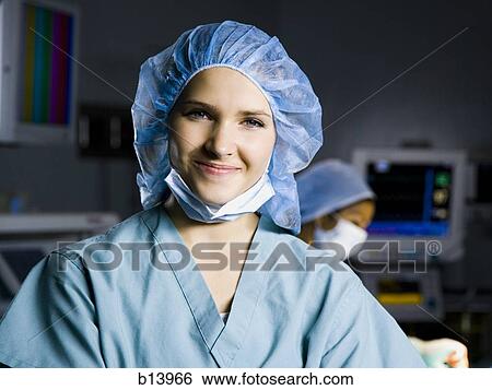 Stock Photograph - Female nurse in scrubs smiling. Fotosearch