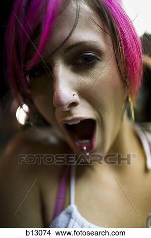 Picture - Female punk with dyed pink hair. Fotosearch