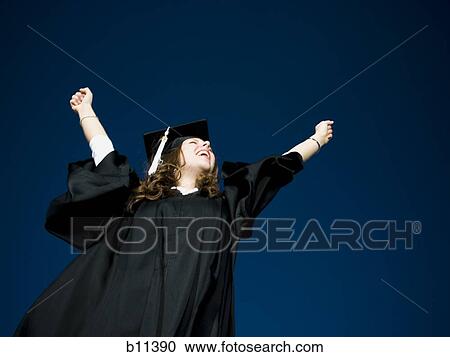 Stock Image - Female student celebrating graduation. Fotosearch