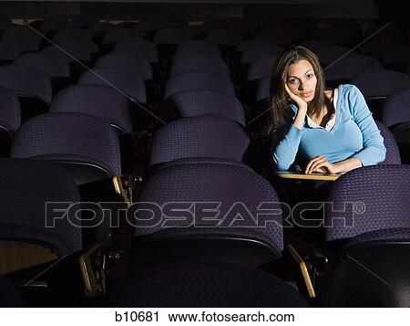 Female student taking notes in lecture hall View Large Photo Image Stock Image - Female student taking notes in lecture hall. Fotosearch