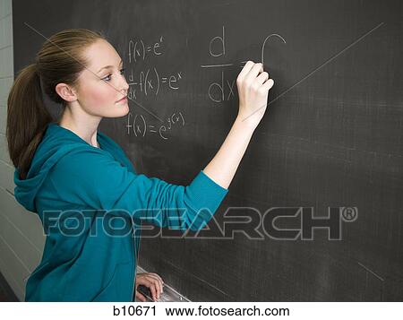 Female student writing out math formula on chalkboard View Large Photo Image Stock Image - Female student writing out math formula on chalkboard. Fotosearch