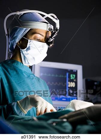 Female surgeon during surgery View Large Photo Image Stock Image - Female surgeon during surgery. Fotosearch