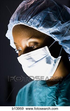 Stock Photo - Female surgeon in scrubs. Fotosearch