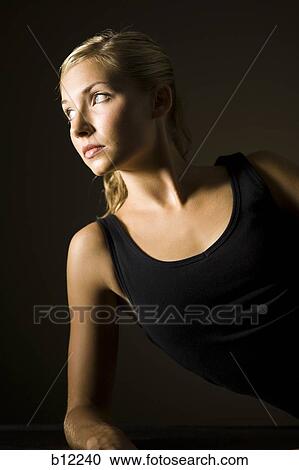Stock Image - Fit exercising woman taking a break. Fotosearch
