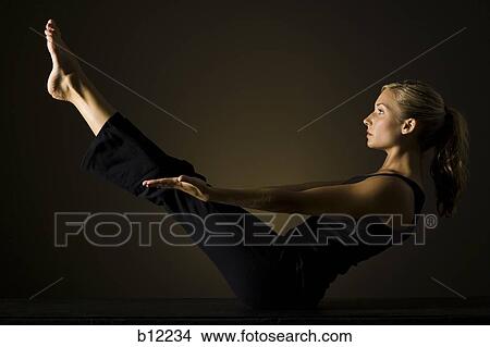 Picture - Fit woman stretching and exercising. Fotosearch