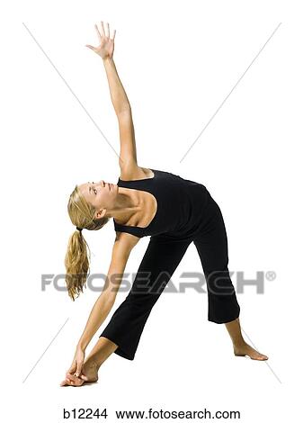 Fit woman stretching and exercising View Large Photo Image Picture - Fit woman stretching and exercising. Fotosearch