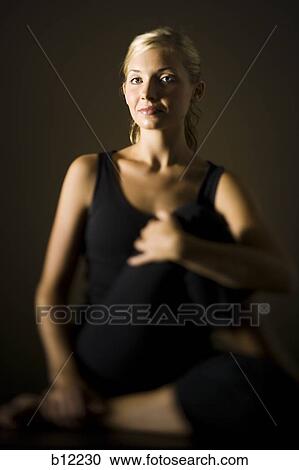 Fit woman stretching and exercising View Large Photo Image Stock Image - Fit woman stretching and exercising. Fotosearch