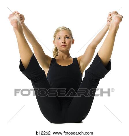 Stock Image - Fit woman stretching and exercising. Fotosearch