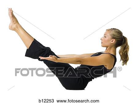 Stock Image - Fit woman stretching and exercising. Fotosearch