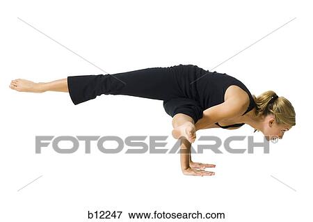 Fit woman stretching and exercising View Large Photo Image Stock Photo - Fit woman stretching and exercising. Fotosearch