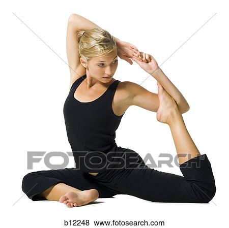 Fit woman stretching and exercising View Large Photo Image Stock Photo - Fit woman stretching and exercising. Fotosearch