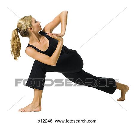 Fit woman stretching and exercising View Large Photo Image Stock Photograph - Fit woman stretching and exercising. Fotosearch