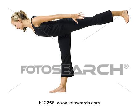 Fit woman stretching and exercising View Large Photo Image Stock Photograph - Fit woman stretching and exercising. Fotosearch