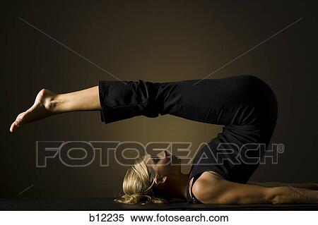 Fit woman stretching and exercising View Large Photo Image Stock Photography - Fit woman stretching and exercising. Fotosearch