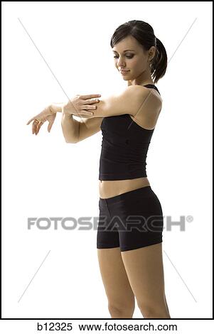 Stock Photography - Fit woman stretching and exercising. Fotosearch