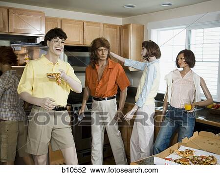 Five mannequins portraying a family in the kitchen View Large Photo Image Stock Image - Five mannequins portraying a family in the kitchen. Fotosearch