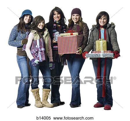Stock Photography - Five women in winter coats with Christmas presents. Fotosearch