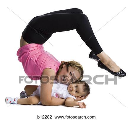 Flexible mother and daughter View Large Photo Image Stock Image - Flexible mother and daughter. Fotosearch