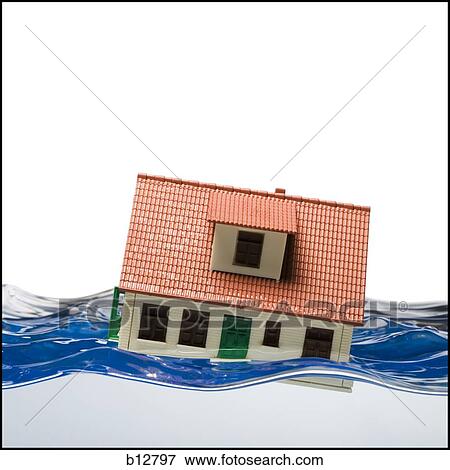 Flooded toy house floating in water View Large Photo Image Stock Photo - Flooded toy house floating in water. Fotosearch