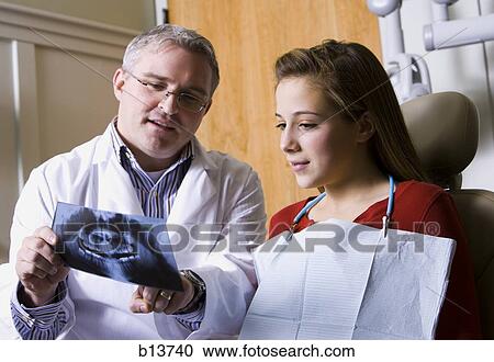 Stock Image - Girl having dental examination. Fotosearch